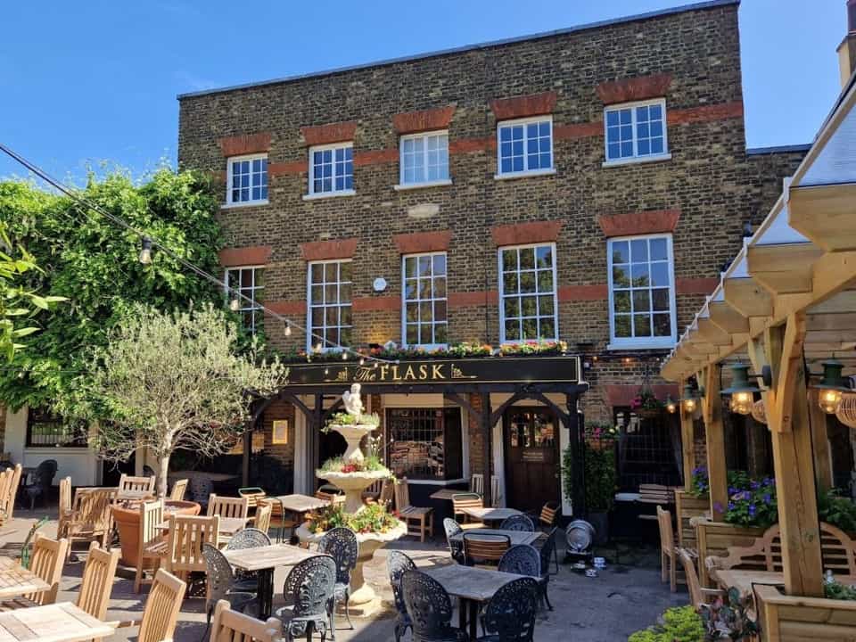 The Flask pub in Highgate — courtyard seating, fountain, and brick facade