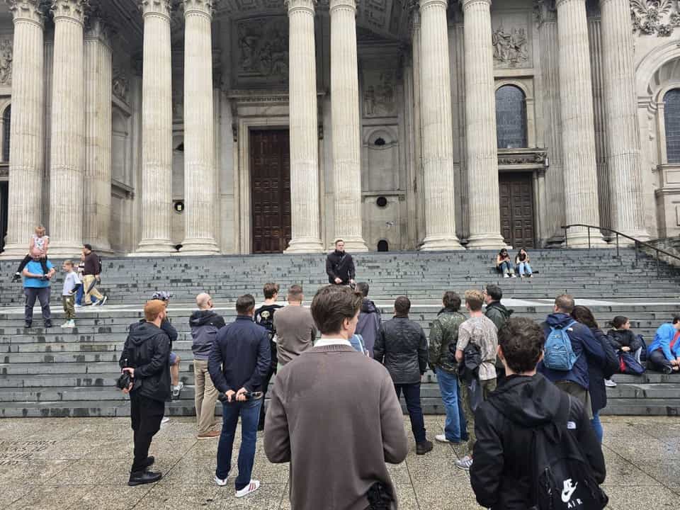 Walkers on a London street during a pub history tour